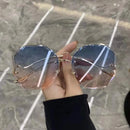 2022无框太阳镜女士海洋水切眼镜女士男士修剪镜片金属弯曲镜腿太阳镜女款防紫外线UV400